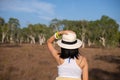 Solo traveller woman standing with hands on head and looking beautiful view at nature,Back view