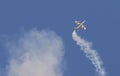 Plane jet of Soloist at the italian tricolor arrows air show performs the acrobatic figure `dead leaf`