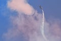 Plane jet soloist at the italian tricolor arrows air show performs the acrobatic figure `dead leaf`