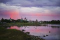 Solovetsky monastery at sunset in the rainbow that is reflected on the surface of the sea in the bay. Royalty Free Stock Photo