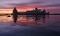 Solovki Island, Russia. Fantastical Pink Sunset Over The Waves Of Holy Lake with Silhouette Of The Solovetsky Monastery Royalty Free Stock Photo