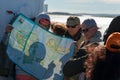 Tourists on the ship, at sea, are developing a route on the map of the Solovetsky Islands