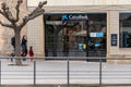 Solsona, Spain - April 3, 2021. Logo and facade of CaixaBank, a Spanish bank, with headquarters in Valencia