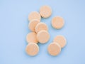 Soluble effervescent vitamins with orange flavour on blue background. Healthcare and medical. Close-up. Vitamin, mineral