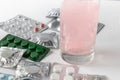 Soluble tablet in a glass of water. Tablets in packing on a light background. Pills