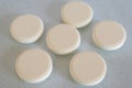 Soluble tablets on glass table top