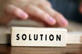 Solution single word for business solution concept printed on wooden block. Royalty Free Stock Photo