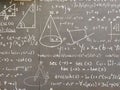 Mathematical formulas and geometric shapes are painted on the school blackboard throughout the frame