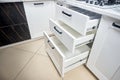 Solution for placing kitchen utensils in modern kitchen - horizontal sliding pullout drawer shelves storage in cupboard for