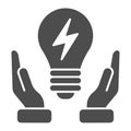 Solution solid icon. Light bulb in hands vector illustration isolated on white. Innovation glyph style design, designed Royalty Free Stock Photo