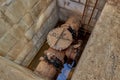 Solutions for drinking water and wastewater. A close-up of an old valve connects the water supply pipeline in a concrete Royalty Free Stock Photo