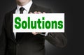 Solutions sign is held by businessman Royalty Free Stock Photo