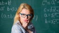 Solve mathematics task. Solve that task. School education basic knowledge. Lady wear eyeglasses smart teacher classroom
