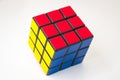 Solved colorful magic cube puzzle on white background