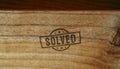 Solved stamp and hand stamping Royalty Free Stock Photo