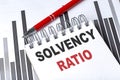 SOLVENCY RATIO text on notebook on chart with pen Royalty Free Stock Photo