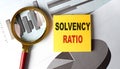 SOLVENCY RATIO text on sticky on chart, business Royalty Free Stock Photo