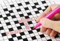 Solving crossword Royalty Free Stock Photo