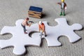 Solving problems fiting together of empty puzzle pieces Royalty Free Stock Photo