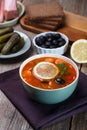 Solyanka, Russian soup with sausage, olives and capers Royalty Free Stock Photo