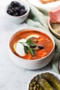 Solyanka, Russian soup with sausage, olives and capers Royalty Free Stock Photo