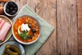 Solyanka, Russian soup with sausage, olives and capers Royalty Free Stock Photo