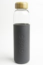 A SOMA Glass Water Bottle With Gray Silicone Sleeve