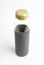 A SOMA Glass Water Bottle With Gray Silicone Sleeve