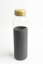 A SOMA Glass Water Bottle With Gray Silicone Sleeve