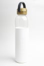 A SOMA Glass Water Bottle With White Sleeve & Grey Handle