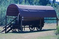 SOMABULA GAME RESERVE, RAYTON AREA, GAUTENG, SOUTH AFRICA - RESTORED PIONEER OX WAGON UNDER A COVER SERVING AS ACCOMMODATION