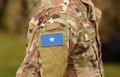 Somalia flag on soldiers arm collage