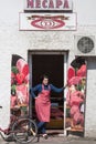 Woman, a butcher, standing in front of a butcher shop, Mesara, in Sombor