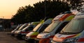 Some Ambulances Parked Outdoors at sunset Royalty Free Stock Photo