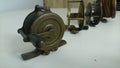 Some antique brass fishing reels Royalty Free Stock Photo