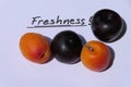 Some apricots and black plums