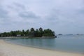 View of the small islet dubbed the Southernmost point of Continental Asia and Palawan Beach, Sentosa, with the Singapore Strait