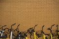 Some bikes parking outside a brick wall Royalty Free Stock Photo