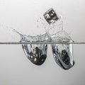 some black game dice drop in water with a splash Royalty Free Stock Photo