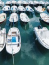 Some boat bright colors on background blue water lake of pier, fishing and boating on summer landscape, holiday travel and sun Royalty Free Stock Photo