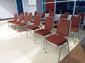 Some brown empty chairs in the room