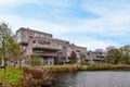 a row of apartments overlooking a body of water