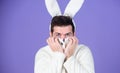 Some bunny loves you. Man wearing rabbit ears. Easter hare. Bearded man in easter rabbit costume. Happy Hipster dressed