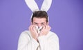 Some bunny loves you. Man wearing rabbit ears. Easter hare. Bearded man in easter rabbit costume. Happy Hipster dressed