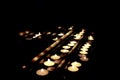 Some candles in the darkness of a church