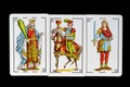 Some cards from the spanish deck for playing cards games and gambling on a black background Royalty Free Stock Photo