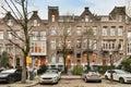 a row of brick buildings with cars parked in front Royalty Free Stock Photo