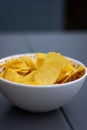 Some chips under a white bowl Royalty Free Stock Photo