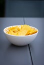 Some chips under a white bowl Royalty Free Stock Photo