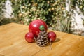 Some Christmas decorations on a wooden table, in a courtyard of Royalty Free Stock Photo